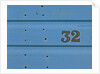 32 Number Sign on Beach hut close-up, Blue Background by Assaf Frank